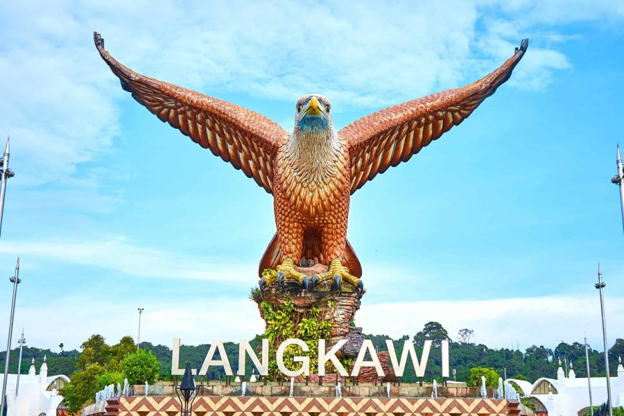 Popular photo spot featuring a huge eagle statue perched over a scenic waterfront plaza.