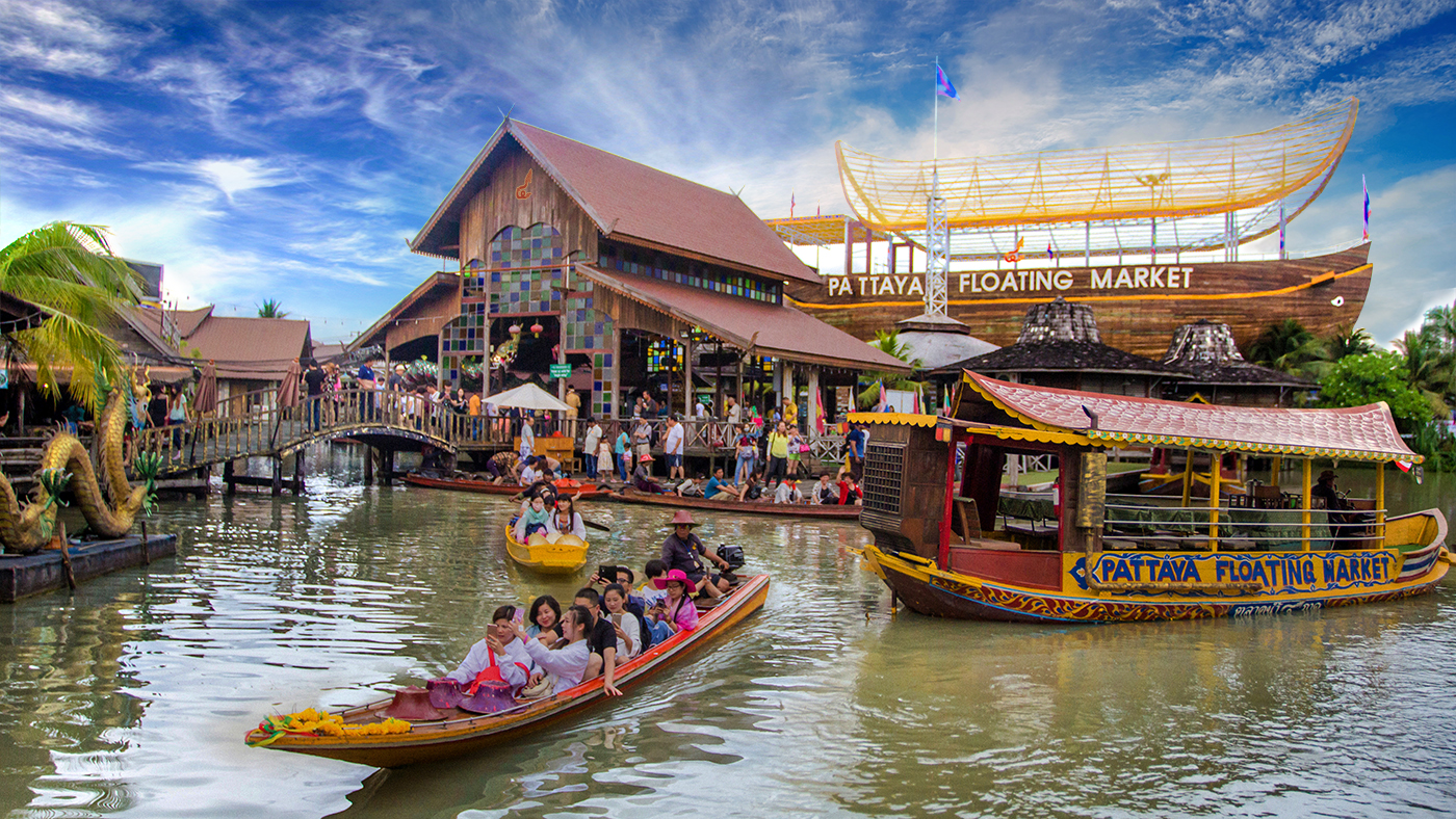 A group of people riding on top of a boat in Pattaya