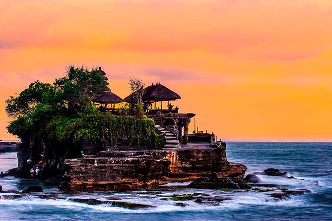 Photograph of Tanah Lot Temple, captured by James Kennedy, showcasing its stunning coastal scenery and cultural significance.