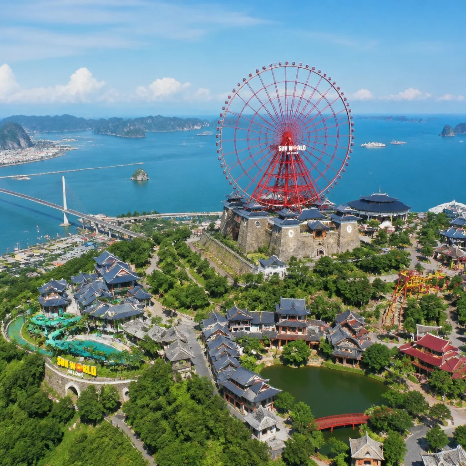 Sun World Ha Long Complex aerial view, amusement park near coastline, Ferris wheel overlooking the bay, vibrant yet organized layout, sea in background, clear sky